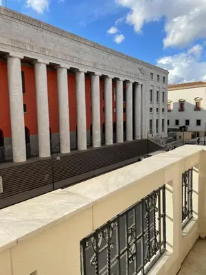 a view of a building with columns at Arricría Room Suite in Palermo