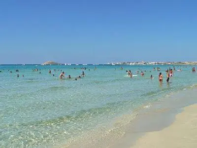 a group of people in the water at the beach at Casa vacanze Ines in Carini