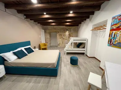 a bedroom with a bed in a room at Posto al Capo in Palermo