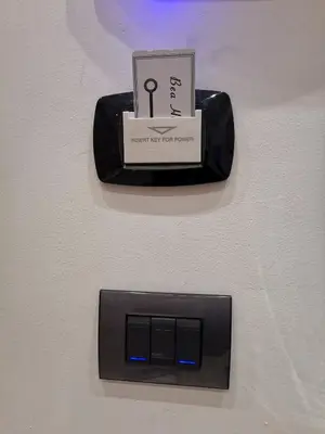 a electronic device with a sign on it on a wall at Bea Home in Palermo