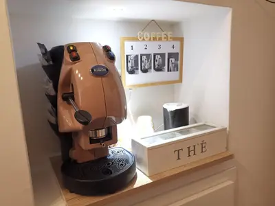 a coffee machine sitting on a counter in a room at Bea Home in Palermo