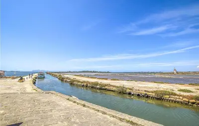 a canal of water with a boat in it at Pietro 2 in San Vito lo Capo
