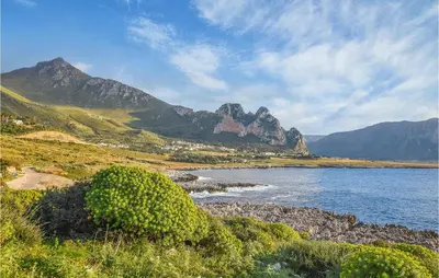 a view of a body of water with mountains in the background at Pietro 2 in San Vito lo Capo
