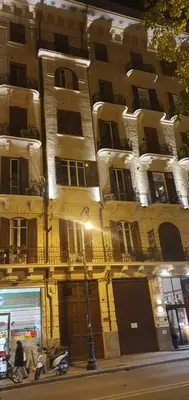 a couple of motorcycles parked in front of a building at A Casa di Anna - Apartment in Palermo