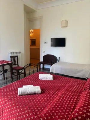 a hotel room with two towels on a bed at A Casa di Anna - Apartment in Palermo
