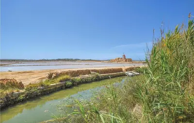 a river next to a body of water at Pietro 3 in San Vito lo Capo