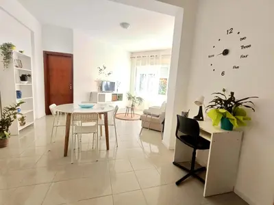 a kitchen and living room with a table and chairs at Perla Home Speciale Vacanze 2026, Casa perfetta per gruppi coppie e famiglie vivi la Sicilia a modo tuo in Alcamo