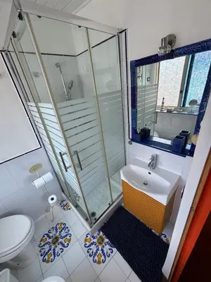 a bathroom with a shower and a sink and a toilet at Casa Lunastella Locazione Turistica in Mondello