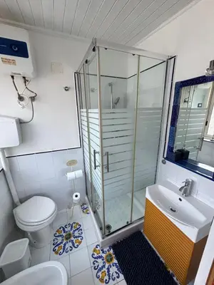 a bathroom with a shower and a toilet and a sink at Casa Lunastella Locazione Turistica in Mondello