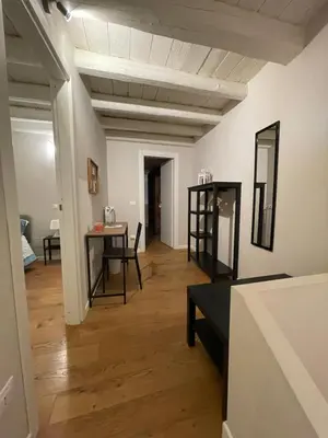 a living room with a table and a dining room at 100 PASSI in Palermo