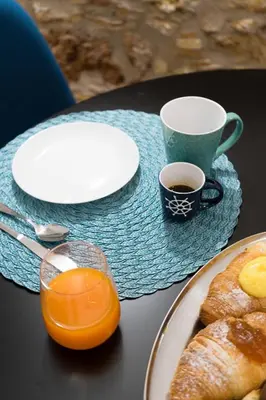 a table with a plate of food and a cup of coffee at Casa Villafilippina in Palermo