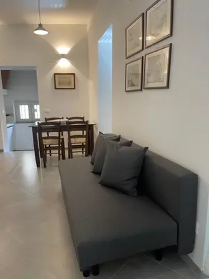 a living room with a couch and a table at Cathedral House Design in Palermo