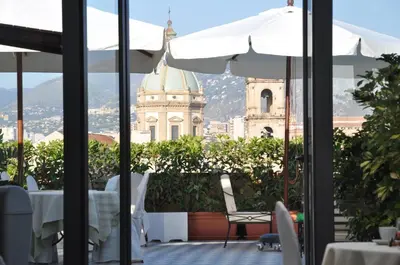 a view of a building from the balcony of a restaurant at Hotel Ambasciatori in Palermo