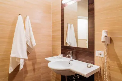 a bathroom with a sink and a mirror at Hotel Ambasciatori in Palermo