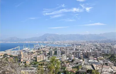 a view of a city with the ocean and mountains at Mono 2 in Lido di Mondello