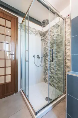 a shower with a glass door in a bathroom at Casa de Paoli - Vista Mare Arenella, Palermo con Parcheggio Privato in Palermo