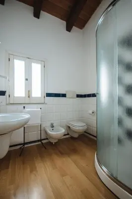 a bathroom with two toilets and a glass shower at Boutique B&B Vintage in Palermo