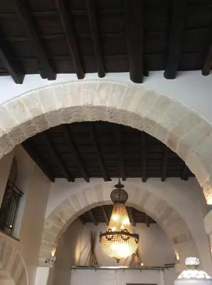 a chandelier hanging from the ceiling of a building at Ucciardhome Hotel in Palermo