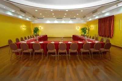 a conference room with a long table and chairs at Best Western Ai Cavalieri Hotel in Palermo