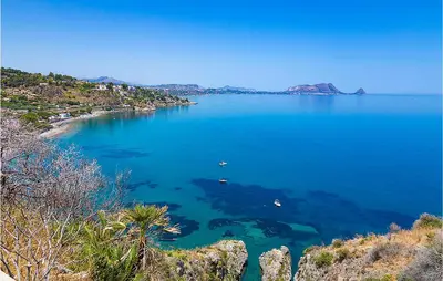 a large blue body of water with boats in it at Mono 2 in Lido di Mondello