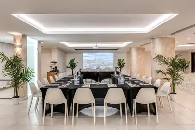 a large dining room with a table and chairs at Casena Dei Colli, Sure Hotel Collection By Best Western in Palermo