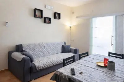 a living room with a couch and a table at La casa di Angy in Terrasini