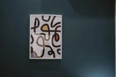 a wall with a picture of a painting with writing on it at Maravigghia Palermo Rooms in Palermo