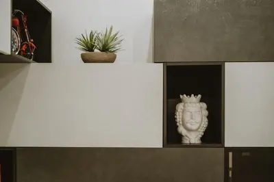 a white statue sitting on top of a shelf at Maravigghia Palermo Rooms in Palermo