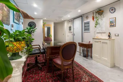 a living room with a table and chairs at Federico 70 Giada Economy in Palermo