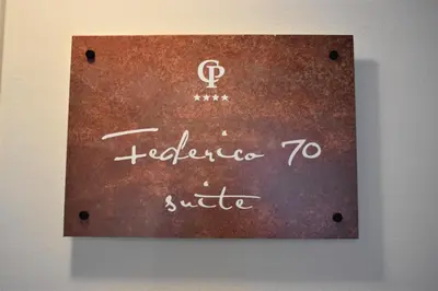 a sign on a wall that says welcome to sufi at Federico 70 Giada Economy in Palermo