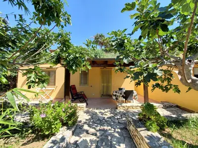 a view of the back of a house with trees at RESIDENCE FEDERICA in Castellammare del Golfo