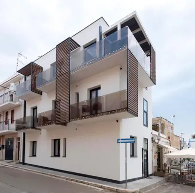 a white building with a balcony on it at Civic03 B&B in Terrasini