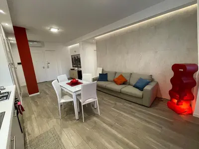 a living room with a couch and a table and chairs at Wagner House in Palermo