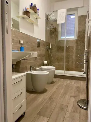 a bathroom with two sinks and a toilet at Wagner House in Palermo