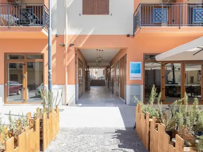 a corridor of a building with potted plants at Apartment Palermo by Interhome in Balestrate