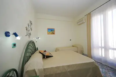 a hospital room with a bed and a window at Hotel Il Melograno in San Vito lo Capo