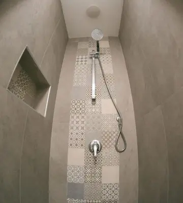 a shower with a shower head in a bathroom at Agorà Home in Terrasini