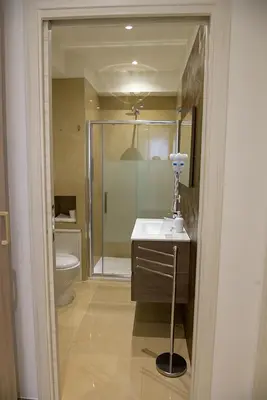a bathroom with a shower and a sink and a toilet at Corallo Rosso B&B in Terrasini