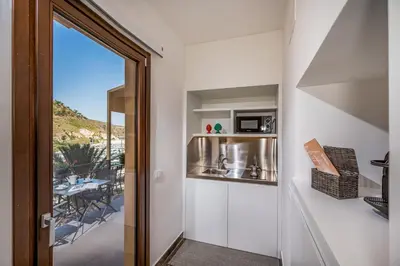 a door leading to a balcony with a view at Suite Altamarea 
