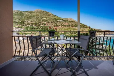 a table and chairs on a balcony with a view at Suite Altamarea 