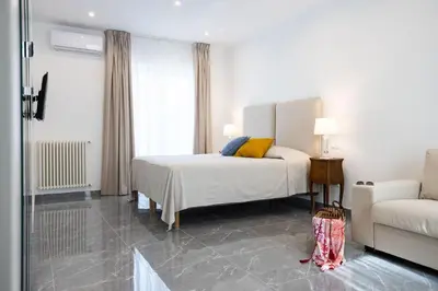 a hotel room with a bed and a couch at Cube 67 - Terrace in Palermo