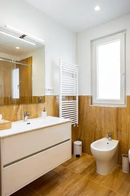 a bathroom with a large white sink and a toilet at Cube 67 - Terrace in Palermo