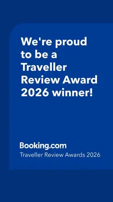 a blue sign that says were proud to be a traveller reviewagency winner at A casa di Mara in Mondello