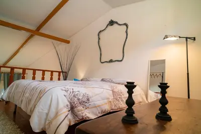 a bedroom with a bed and a mirror on the wall at A casa di Mara in Mondello
