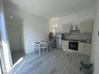a kitchen with a table and chairs in it at Le dimore Luxury Rooms in Palermo