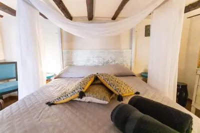 a bedroom with a bed with a cheetah blanket on it at Caveau in Palermo