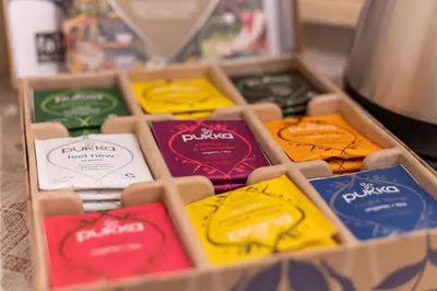 a box filled with different colored packets of food at Caveau in Palermo