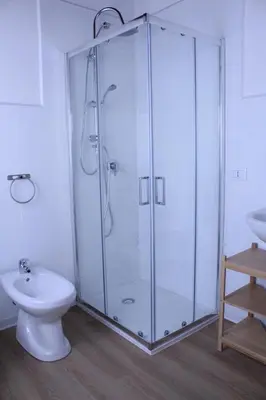 a bathroom with a shower with a toilet and a sink at Terrasini 2000 Home Holidays in Terrasini