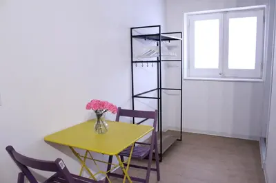 a dining room with a table and chairs and a window at Terrasini 2000 Home Holidays in Terrasini