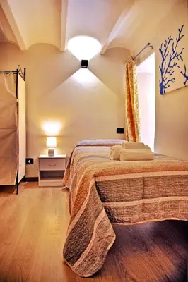a bedroom with a large bed in a room at Palermo alla Gancia Room in Palermo